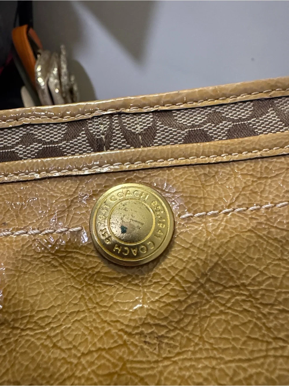 Coach Signature Mini Wristlet in Brown and Tan